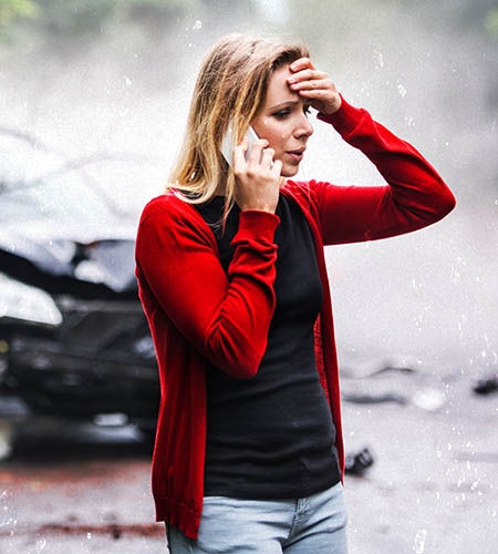 "Woman on the phone after a car accident"